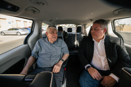 Tom Egan, CEO of Foundation for Senior Living, takes a ride in a Waymo with a beneficiary of FSL named Santos in Chandler, Ariz.