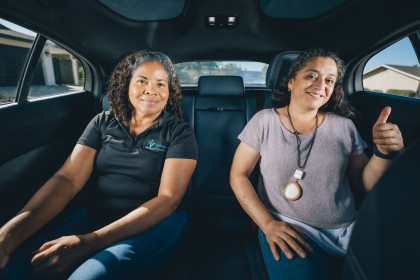 Juana and Minerva in the backseat of a fully autonomous Waymo One ride-hailing vehicle