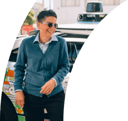 Waymo Community partners standing in front of Waymo car